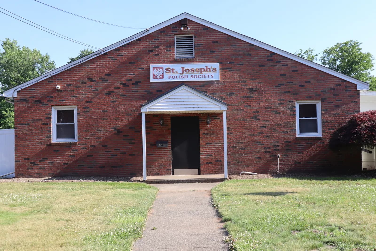 Front of the brick hall at St. Joseph's Polish Society, 88 E Main St